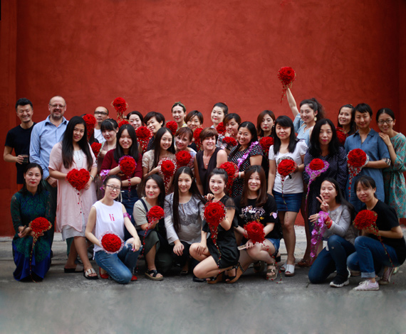 Proud students who follow the EFDE program show proudly their newly created glamelia bridal bouquet.