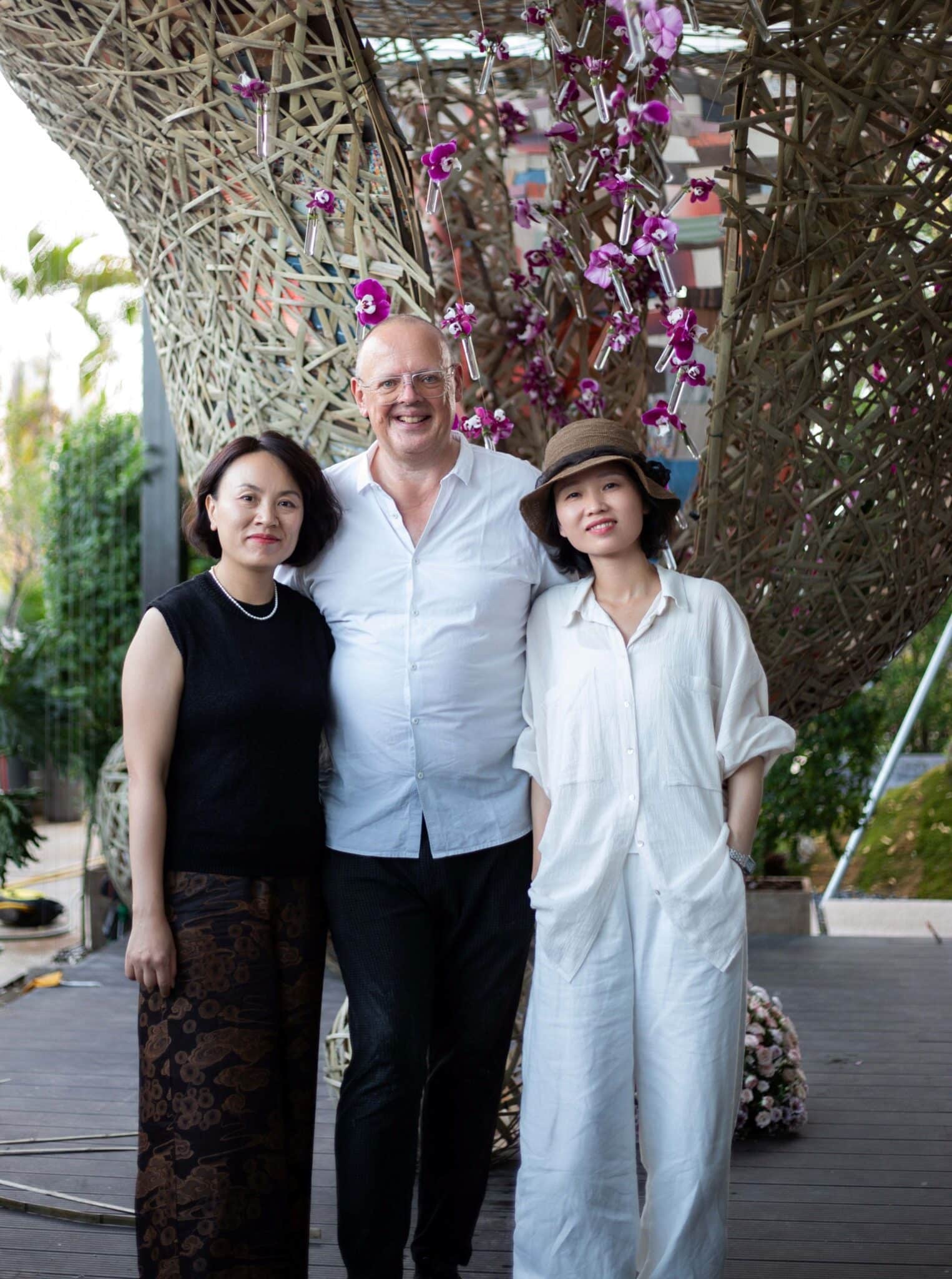 In front of an enormous floral object. Proud students and teacher!